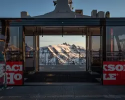 JHMR Winter Tram doors open with a gorgeous view Of Tetons