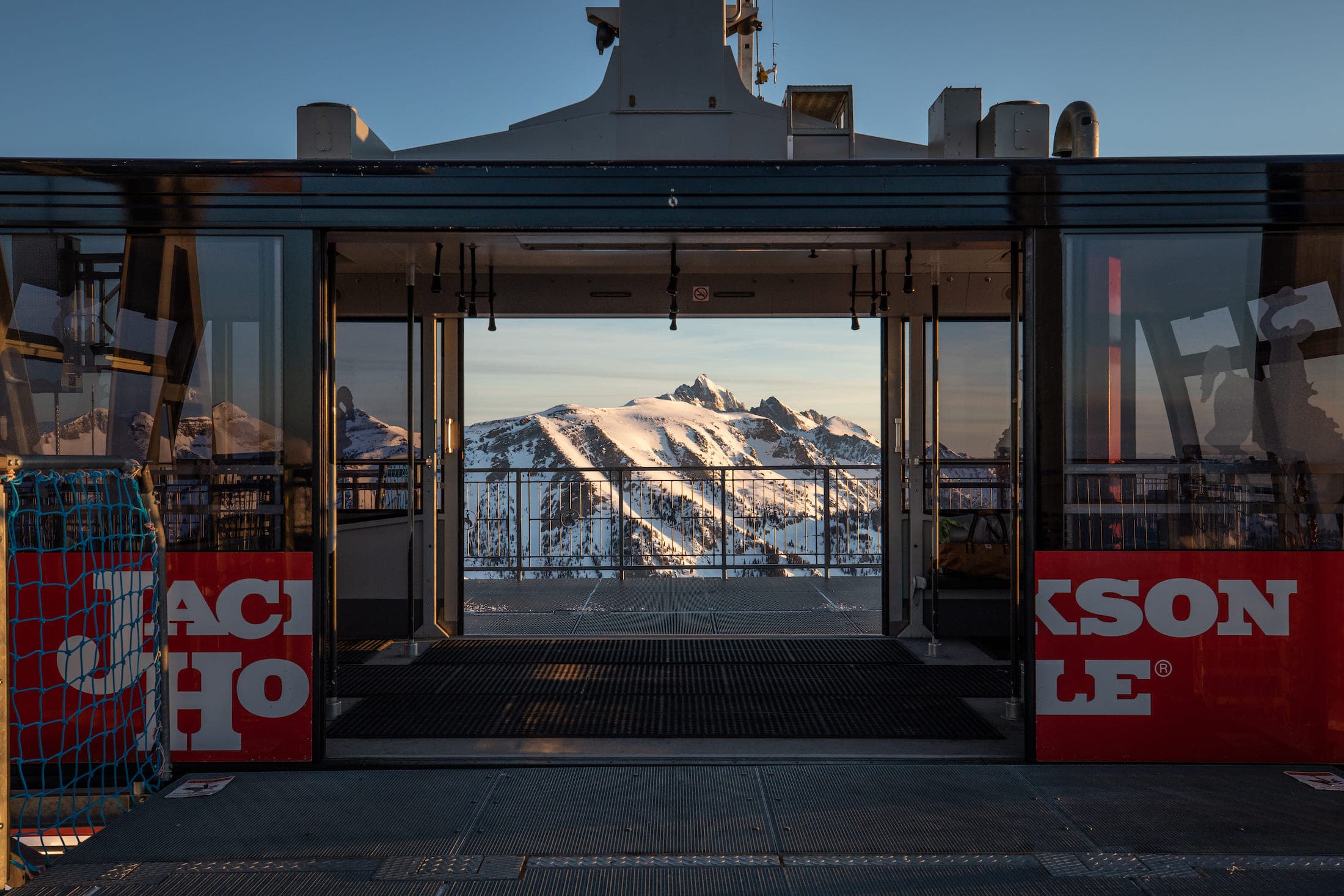 JHMR Winter Tram doors open with a gorgeous view Of Tetons