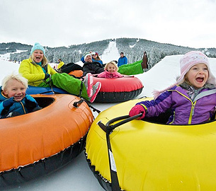 Tubing down the mountain in the snow. Tubing down the mountain in the snow.