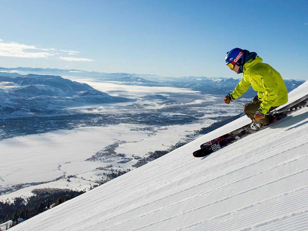 Skier On Top Of The Mountain.